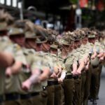 7.Veterans and serving members of the Australian and New Zealand armed forces march during an Anzac Day parad (Getty)