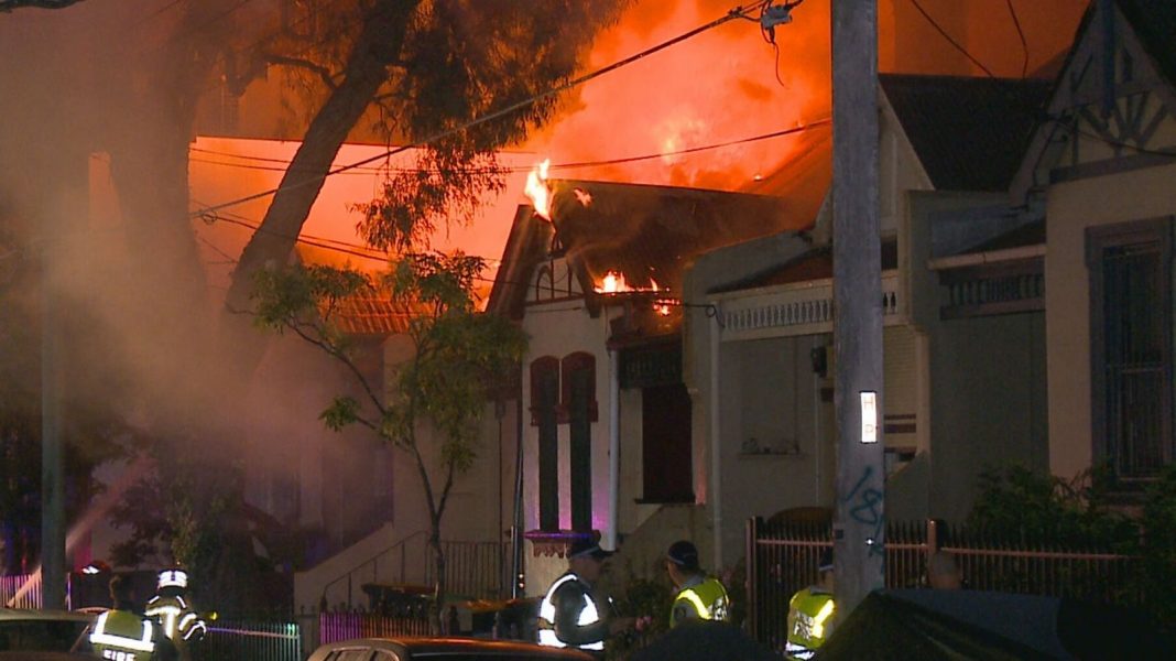 A fire has spread through a row of terrace homes in Newtown