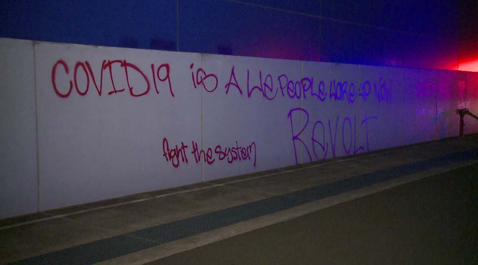 Police discovered anti-government graffiti on nearby buildings.(ABC News)