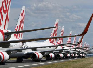 버진 오스트레일리아(Virgin Australia) 승무원, 감염 중에 비행 Virgin Australia jets sit idly. (AAP)