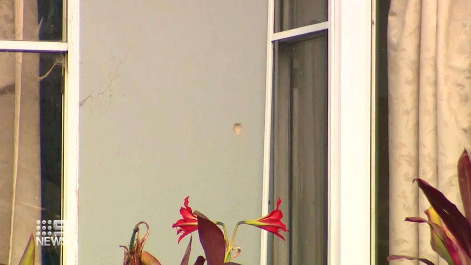 Bullets were peppered across the windows and walls of the family home's living room. (9News)