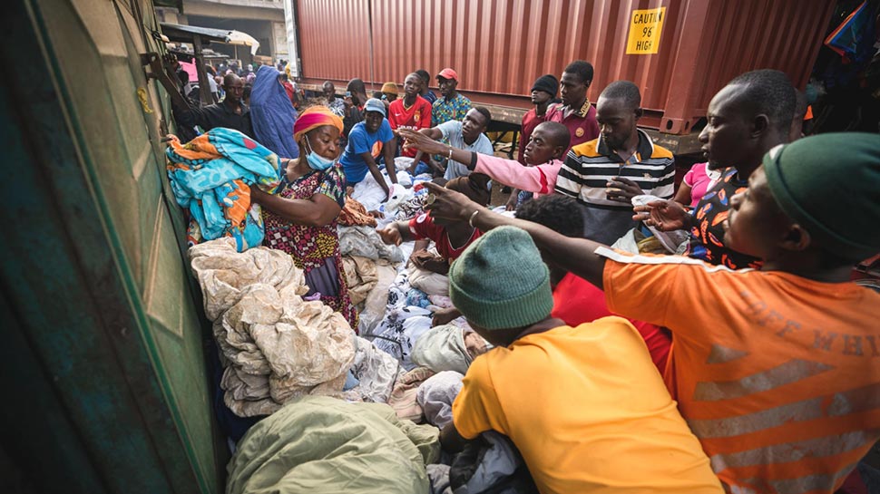 Many of the clothes donated to op shops end up in Kantamanto market, in the Ghanaian capital Accra. Foreign Correspondent Andrew Greaves
