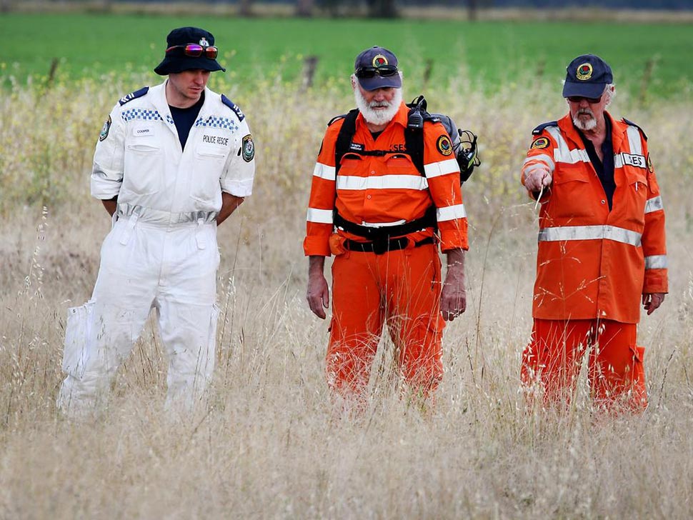 Police and SES conduct a line search near the property where the teen killed the 10-year-old girl. Picture Nathan Edwards