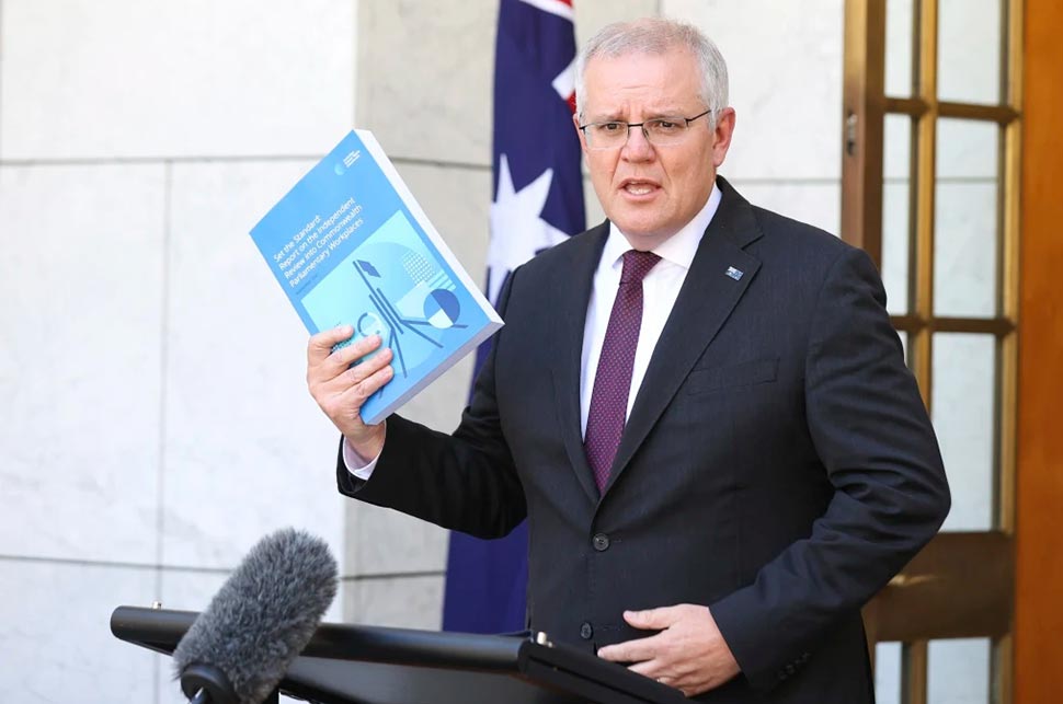 Prime Minister Scott Morrison with the Jenkins review.CREDITALEX ELLINGHAUSEN