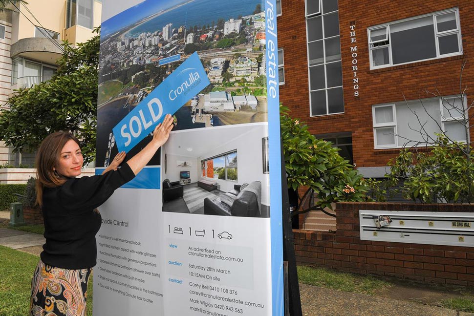 Real estate agent Adrianna May poses for a photo at a newly sold property in Cronulla. Credit SIMON BULLARDAAPIMAGE
