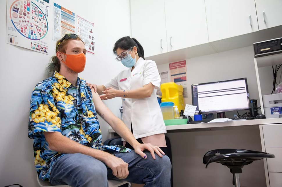 Health worker and student Max Eberle receives a booster vaccination in Parramatta on Thursday.CREDITCOLE BENNETTS
