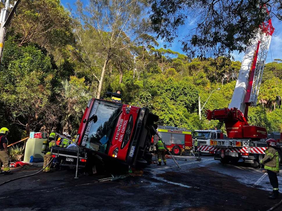 Police have launched an investigation after a tradie was flown to hospital after he spent almost three hours trapped underneath a garbage truck in Sydney’s northern beaches. Picture NSW Ambulance