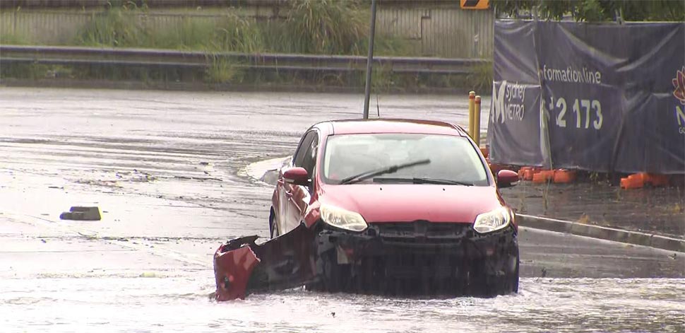 Some cars have been abandoned due to the floodwaters. (9News)