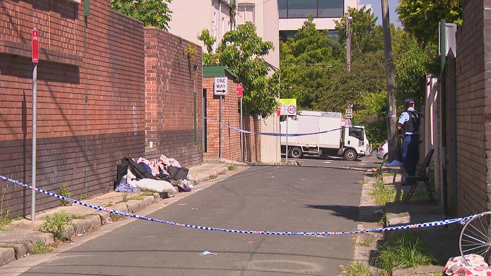 The bodies of two men were found at a unit on Cleveland Street on Saturday night. (9News)
