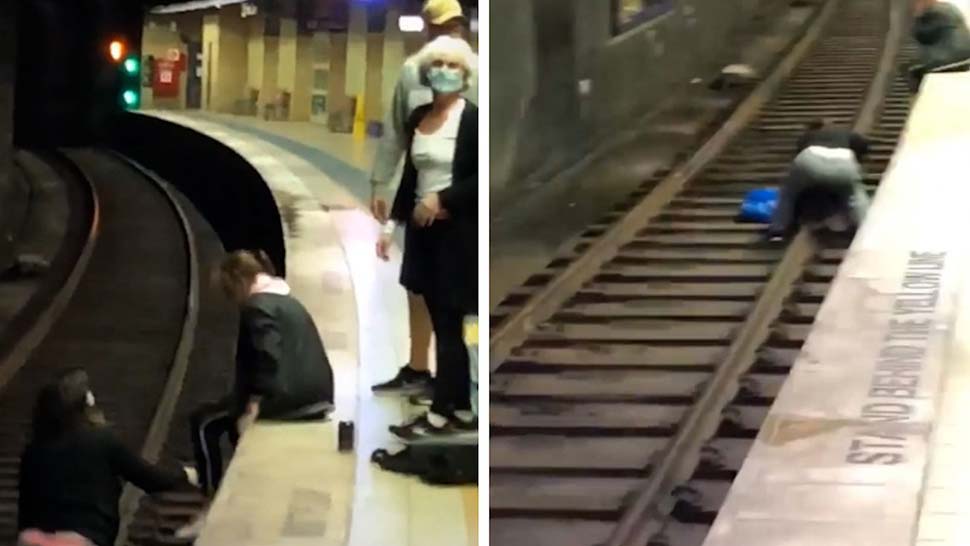 Two commuters jumped onto the track after a man fell. (9News)