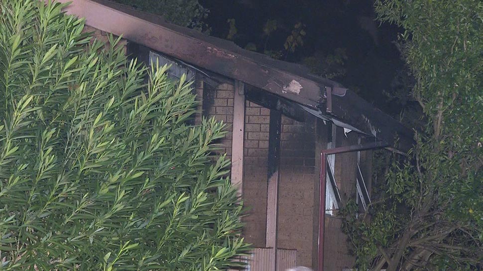 Windows cracked in the heat of the blaze causing loud noises to ring out across the street. (9News)