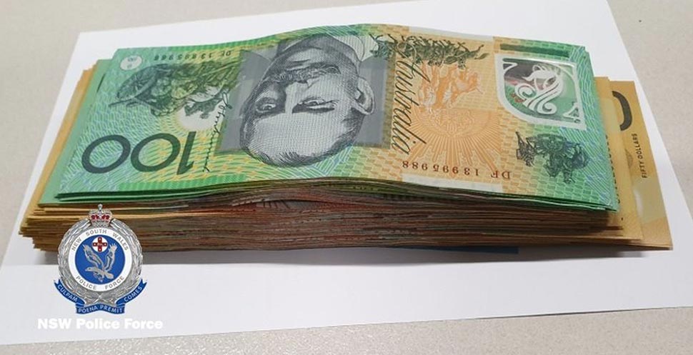 A wad of cash is pictured following 'Operation Colossus'. (NSW Police)