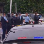 Police surround the funeral of Omar Zahed. (9News)