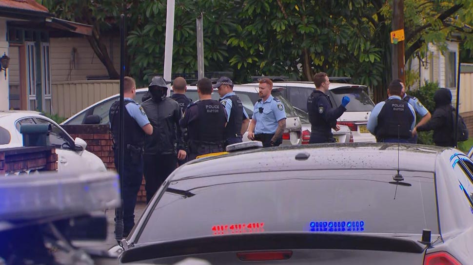 Police surround the funeral of Omar Zahed. (9News)