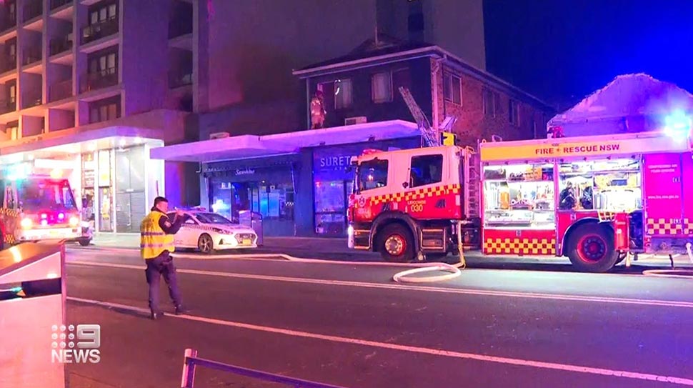 Firefighters who heard screams had to force open the door of a locked room to rescue three teenagers from a burning apartment in Sydney. (Nine)
