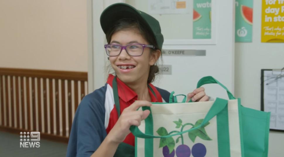 Kiara Misciagna first practiced skills at her school's Mini Woolies at Castle Hill. She now works as an official Woolworths employee. (9News)