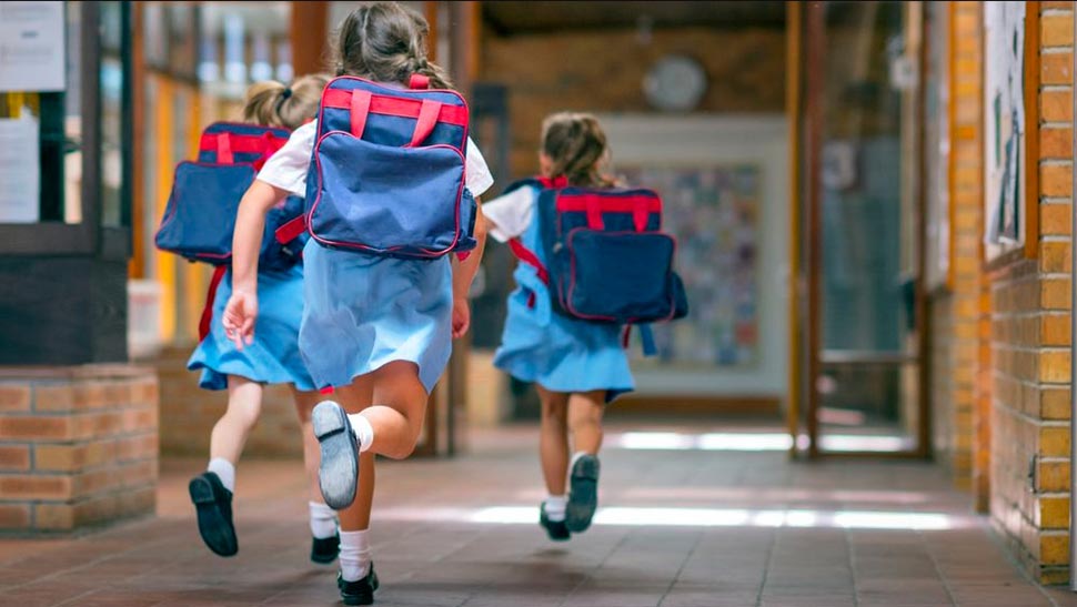 NSW families will get a $150 back to school voucher to help with the cost of supplies like books and bags. (Getty)