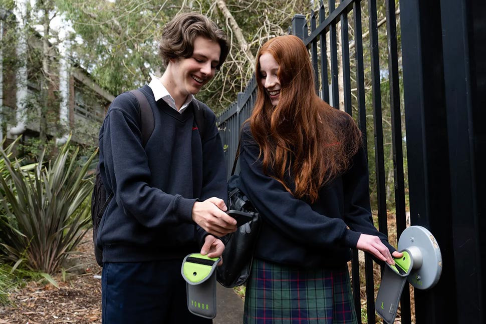 Davidson High School year 10 students Daniel Kenny and Annika Hore with the pouches used by the school to limit phone usage during school hours.CREDITJANIE BARRETT