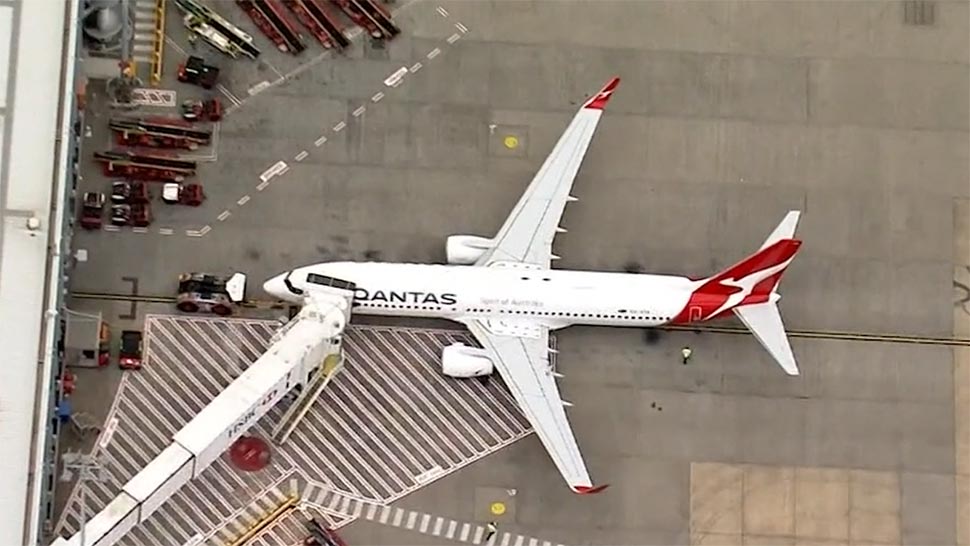 Qantas went from practically no passengers to massive queues over the course of the financial year as domestic and international borders opened. (Louise Kennerley)