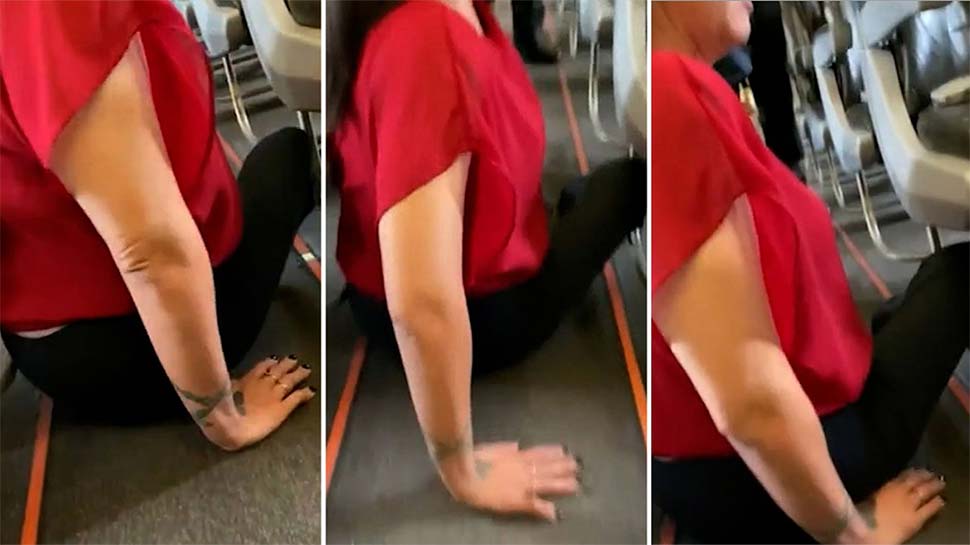 In a video, Natalie Curtis can be seen crawling along the floor to get to her wheelchair and disembark a Jetstar plane. (Nine)
