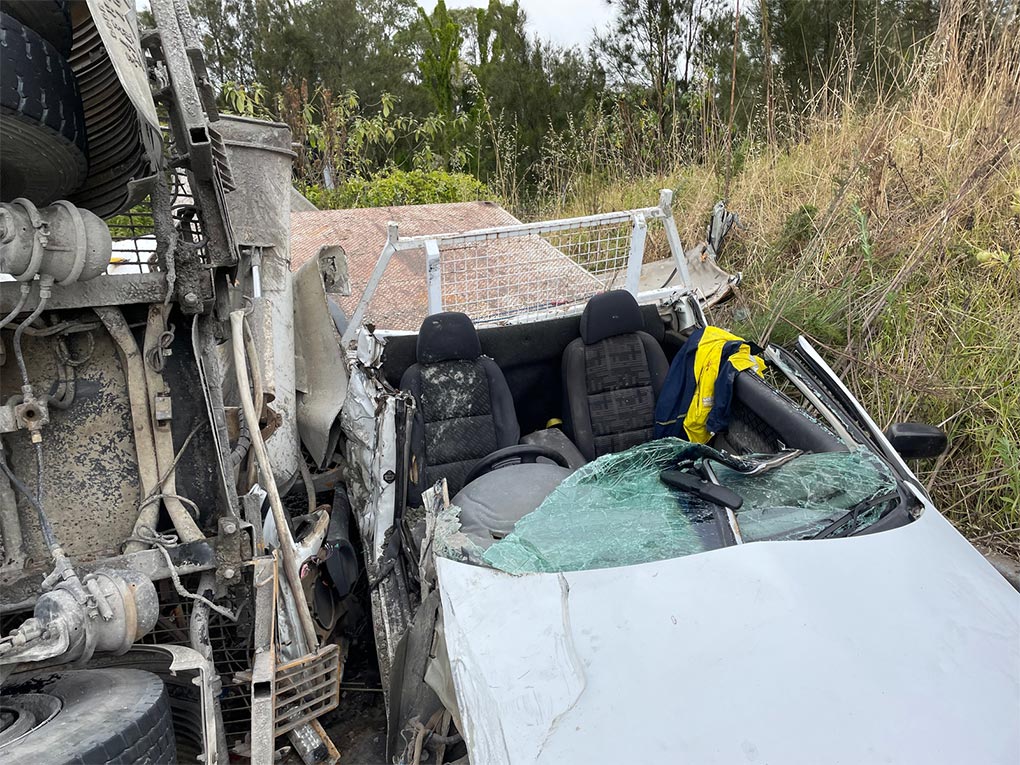 A cement mixer collided with two cars and a pantech truck and then flipped onto its side. (Fire and Rescue NSW)