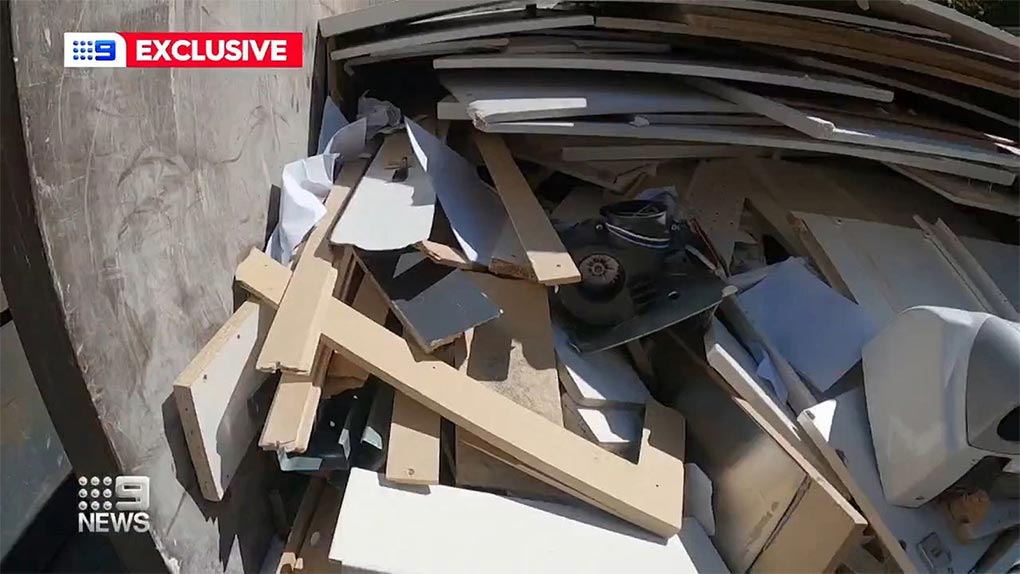The information on paperwork piled in the skip includes names, addresses, transaction histories and account numbers. (Nine)