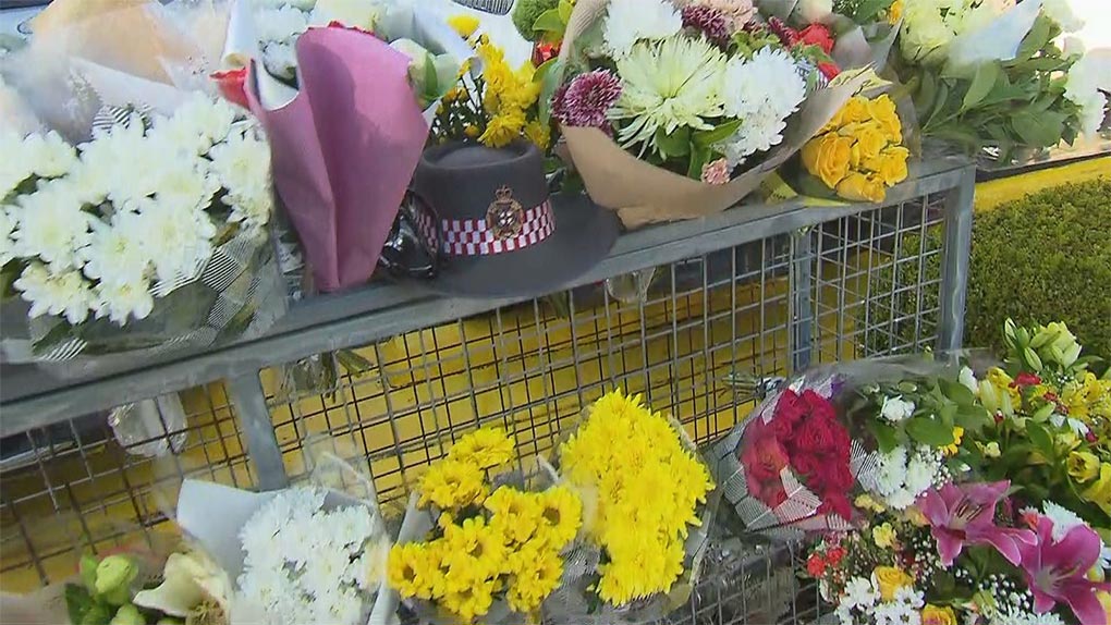 Flowers were laid at Campbelltown McDonald's after Tougher's alleged murder. (Nine)