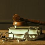 gavel-with-books-old-wooden-desk-FREEPIK