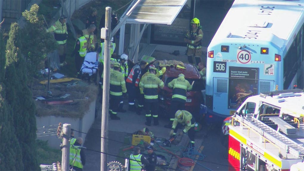 Two people are in hospital after a car crashed into a bus shelter in Drummoyne, Sydney. (9News)