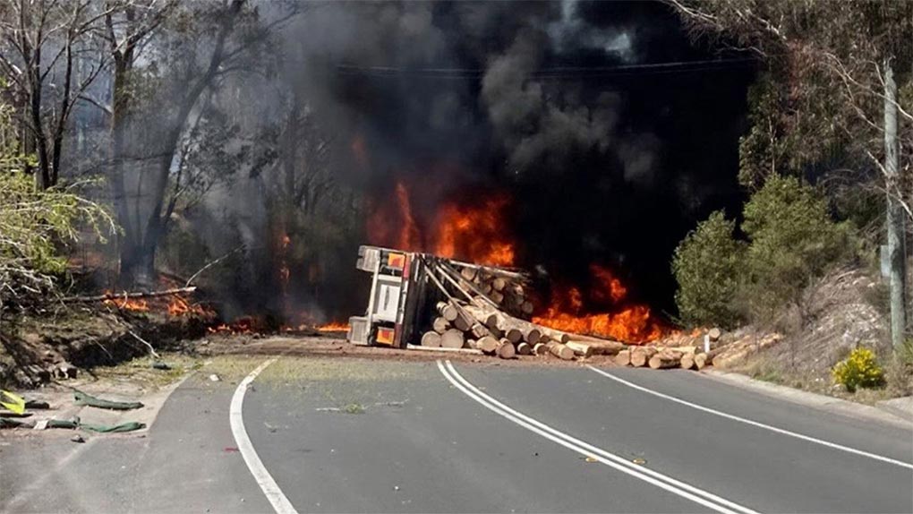 The log truck caught ablaze after the crash, (Live Traffic NSW)