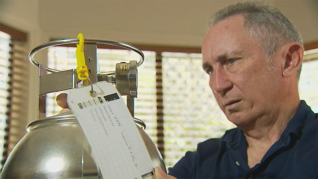 Jim Dodrill from Ipswich Residents Against Toxic Environments with one of the air monitoring canisters. (9News)