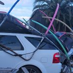 An overturned trampoline was blown onto parked cars. (2GB)