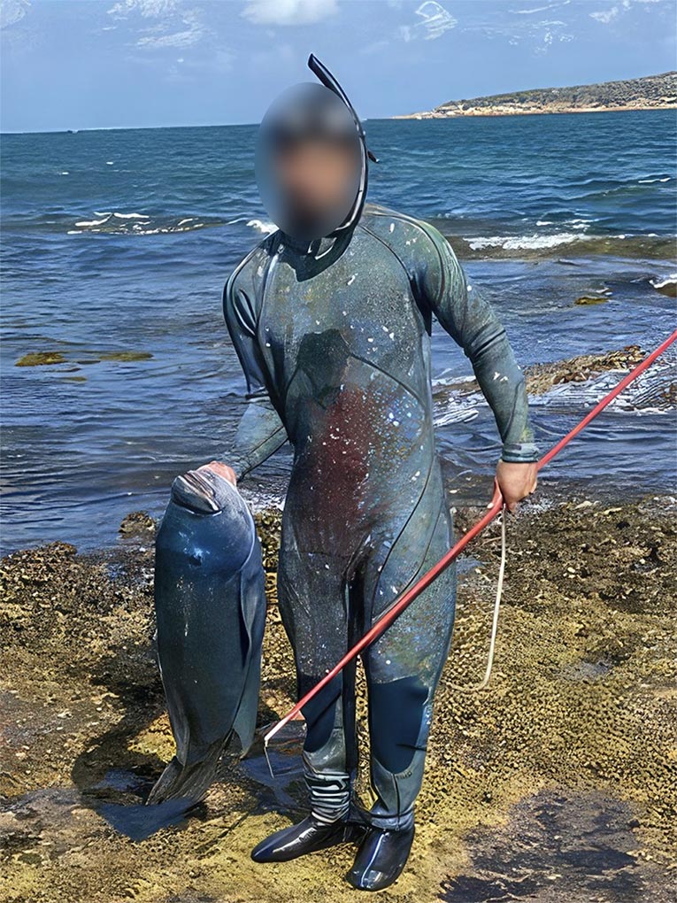 The spearfisher who is alleged to have killed 'Gus' a resident blue groper of Port Hacking. (Nine Supplied)