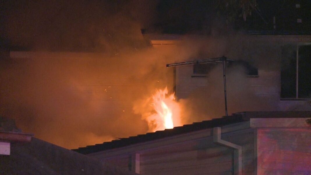 Ten people escaped the house fire in Macquarie Fields. (9News)