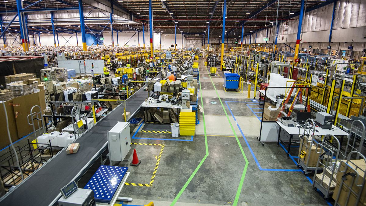 Amazon Associates working inside the Amazon Fulfilment Centre in Moore Park, Sydney. (Supplied)