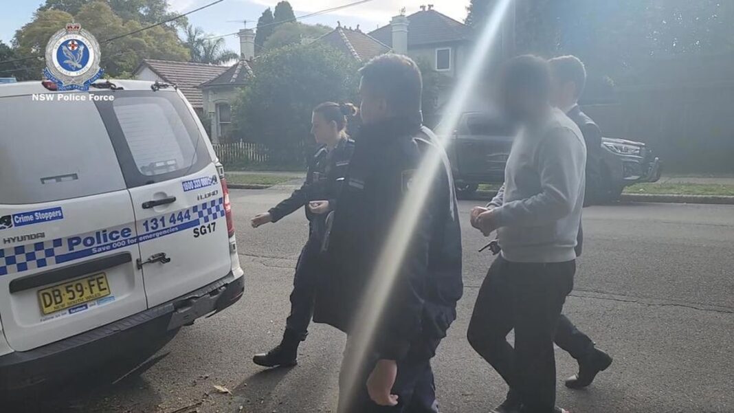 Ahmed Al-Sudani is taken into police custody. (NSW Police)