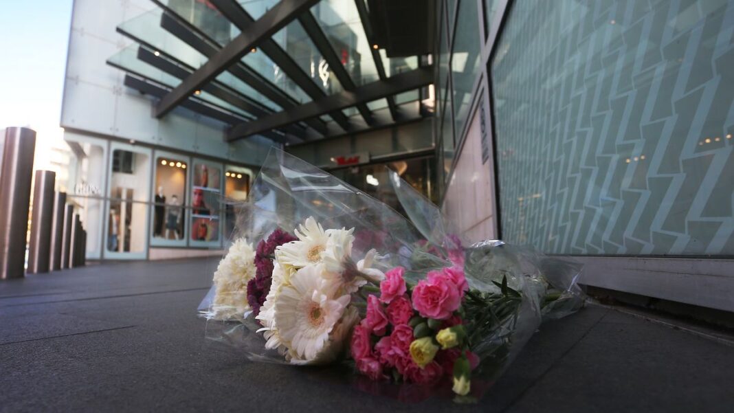 Flowers laid outside the Westfield shopping centre at Bondi Junction after a stabbing spree left six dead. (Lisa Maree Williams)