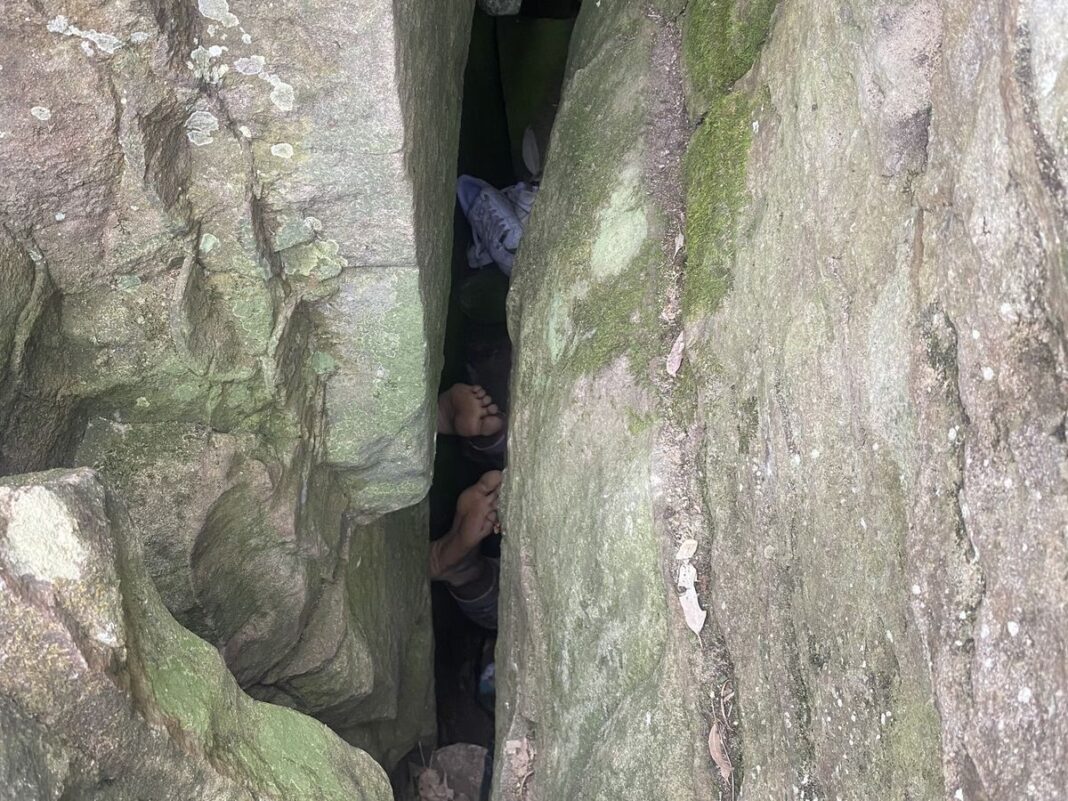 The woman became stuck in the slim crevice after trying to retrieve her dropped phone. (NSW AmbulanceFacebook)