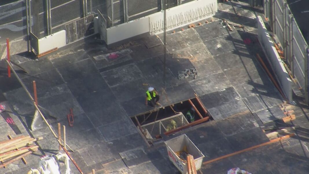 The man fell through a deck at a worksite before 11am. (9News)