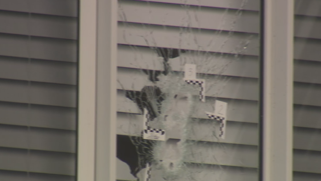 Bullet holes in the windows of the Marsden Park home. (Nine)