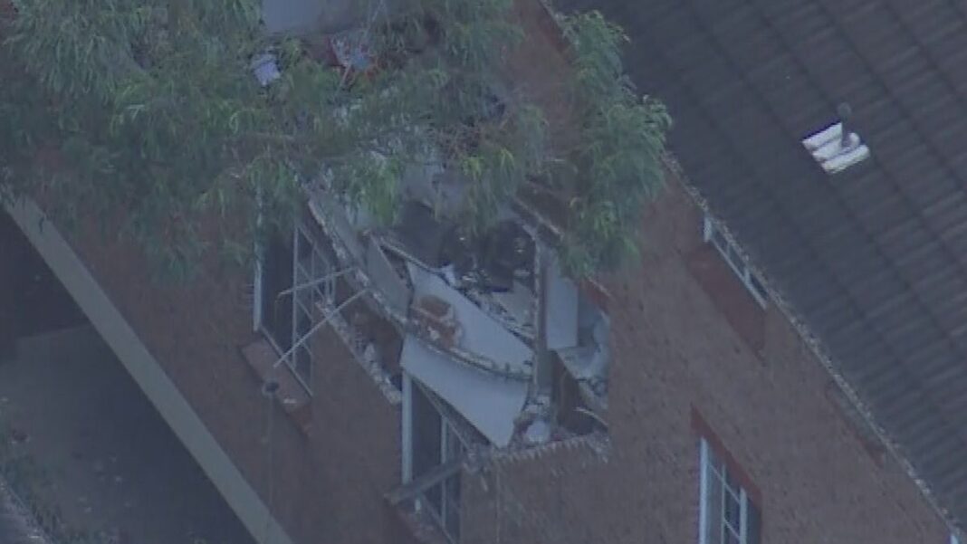 One person has been taken to hospital after an explosion blew out the wall of a second-storey flat in Lidcombe, Sydney. (9News)