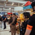 BANGKOK, THAILAND – JULY 28 Police monitoring the cordoned area in Or Tor Kor market on July 28, 2025 in Bangkok, Thailand. (Photo by Mailee Osten-TanGetty Images)