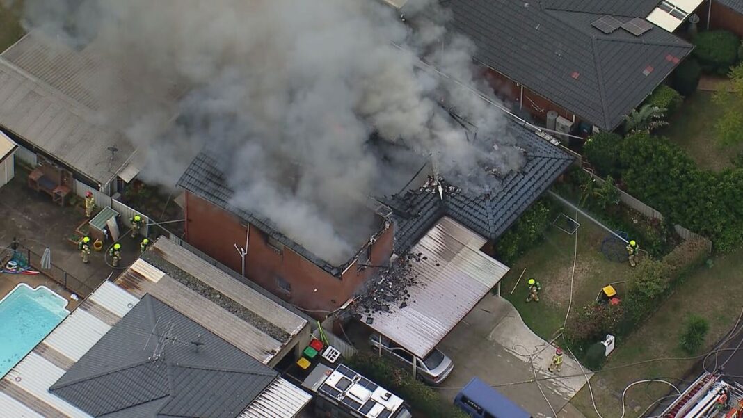 Over 20 firefighters are battling to control a housefire in western Sydney which collapsed the roof. (9News)