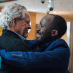3.A hug three decades in the making between Bruce Anschau and Edward Kankaka. (ABC News_Bridget Murphy)