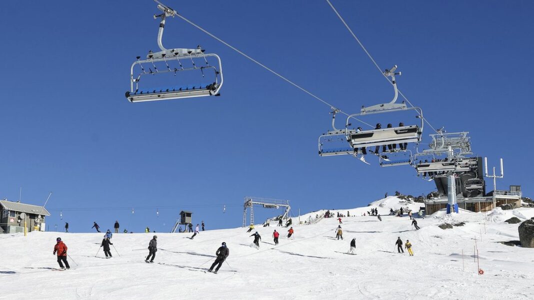 Skiers and snowboarders coming down the Legends run alongside the new Mt Perisher 6 chairlift on the opening day of the chairlift, at Perisher resort, on Friday 27, June 2025. (Alex Ellinghausen)