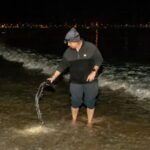 17.Guy Dunstan measures the sea water temperature on Manly seafront before dawn every morning and writes the numbers in chalk on the southern wall above the beach. Photo Alec Smart