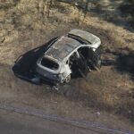 7.Police are investigating after a body was found inside of a burning car west of Sydney. (9News)