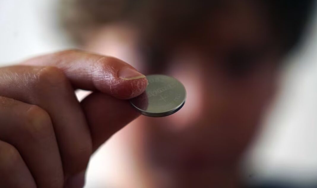 A button battery, which is a type of lithium-ion battery, is found in many everyday electronic devices. (Australian Story Anthony Sines)