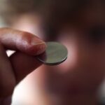 12.A button battery, which is a type of lithium-ion battery, is found in many everyday electronic devices. (Australian Story Anthony Sines)