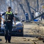 10.Police inspect the scene after a body was found in burnt-out country at Gobur. (Jason South)_9news